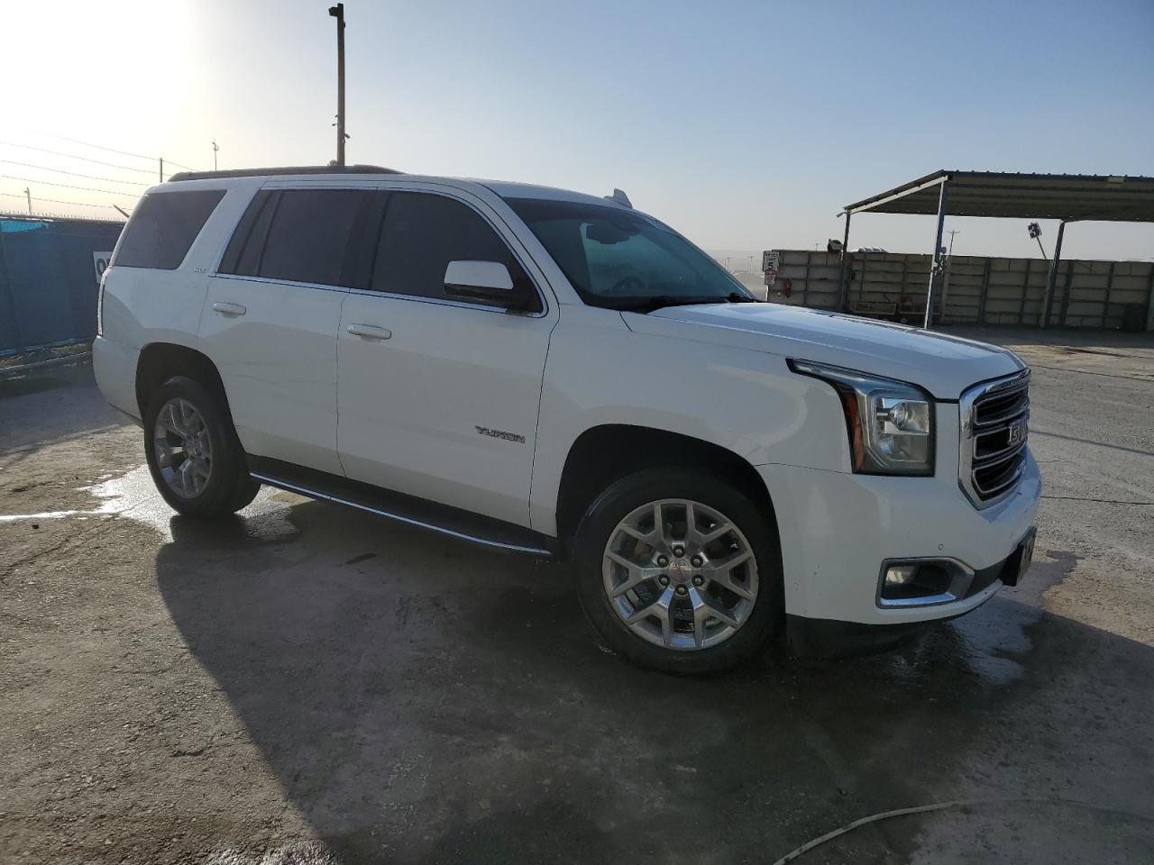 2015 GMC Yukon VIN 1GKS1BKC4FR664092 Copart auction photo, rear end / minor dent/scratches damage thumbnail 4