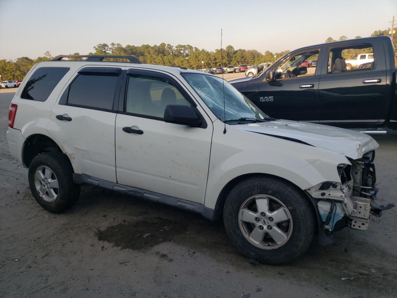 2011 Ford Escape VIN 1FMCU0DG0BKA52854 Copart auction photo, front end / side damage thumbnail 4