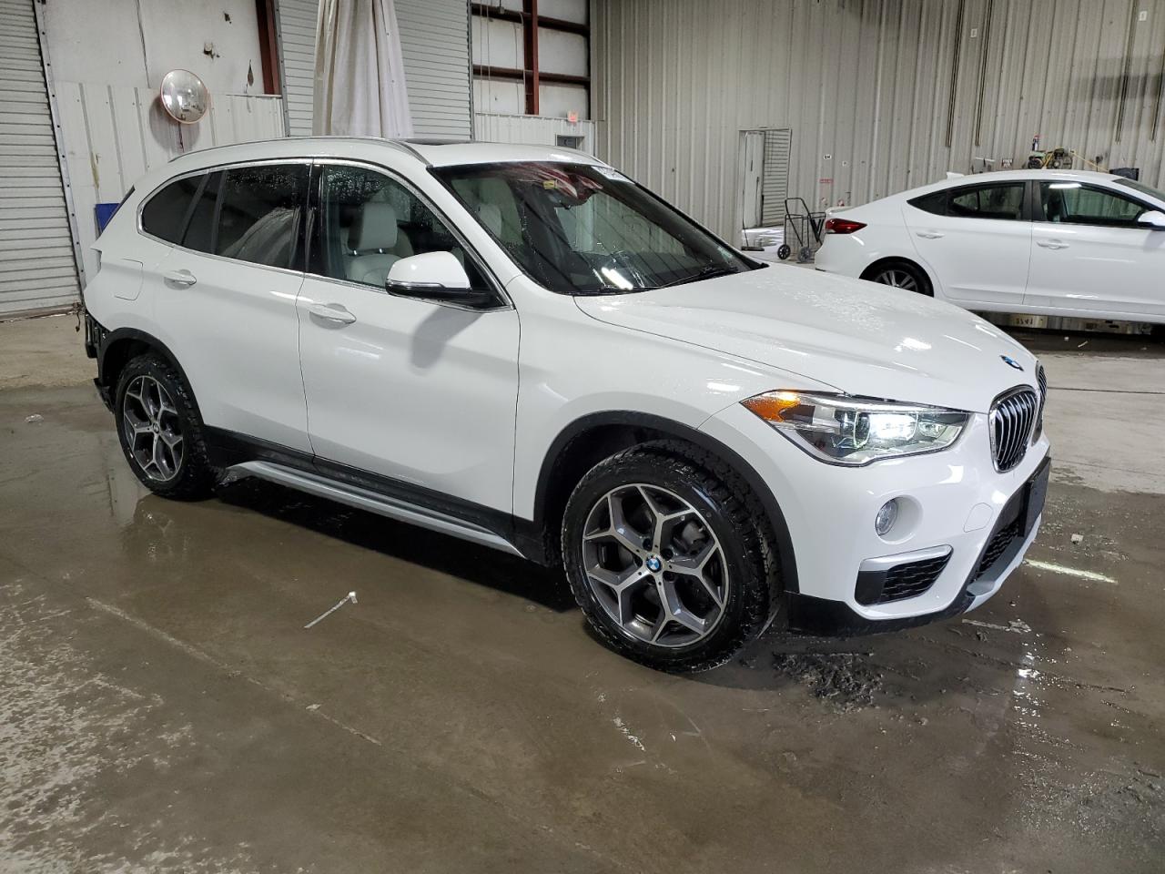 2018 BMW X1 VIN WBXHT3C31J3H33391 Copart auction photo, rear end damage thumbnail 4