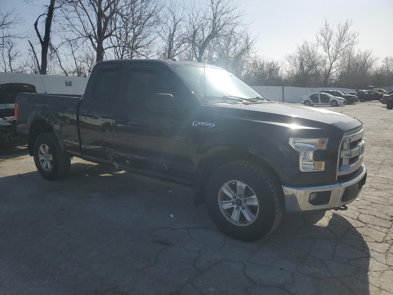 2015 Ford F-150 VIN 1FTFX1EFXFKD92667 Copart auction photo, rear end / all over damage thumbnail 4