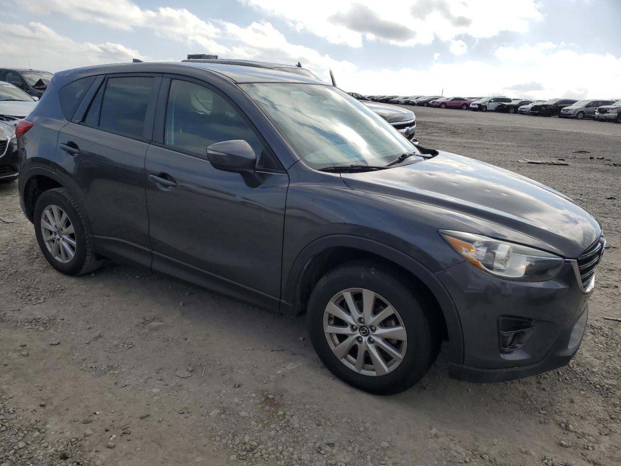 2016 Mazda CX-5 VIN JM3KE2CY4G0634114 Copart auction photo, hail damage thumbnail 4