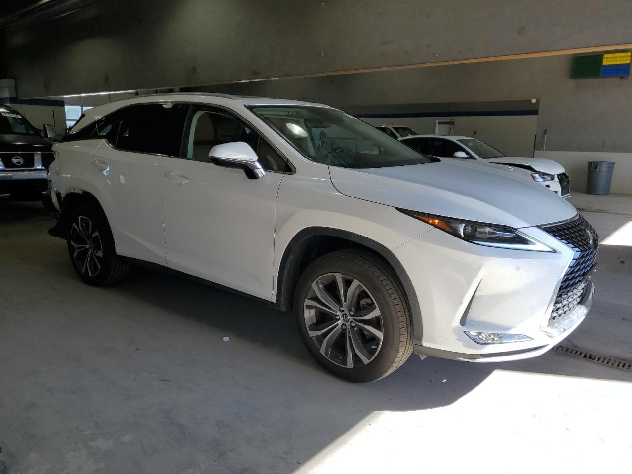 2022 Lexus RX VIN JTJHZKEA2N2024718 Copart auction photo, rear end / side damage thumbnail 4