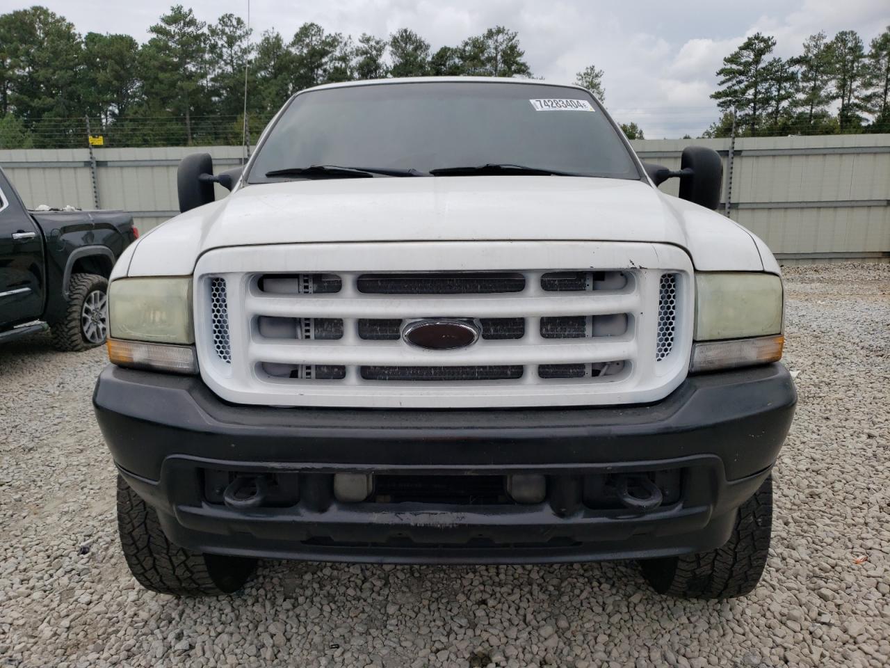 2004 Ford F250 VIN 1FTNX21P04EB76709 Copart auction photo, vandalism / mechanical damage thumbnail 5