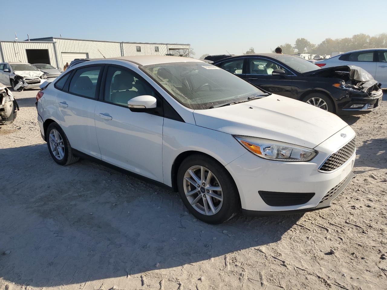 2015 Ford Focus VIN 1FADP3F2XFL351082 Copart auction photo, hail / rear end damage thumbnail 4