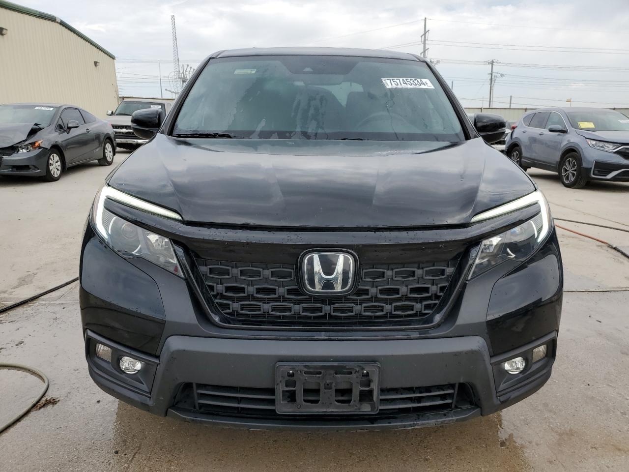 2021 Honda Passport VIN 5FNYF7H54MB000021 Copart auction photo, undercarriage / minor dent/scratches damage thumbnail 5