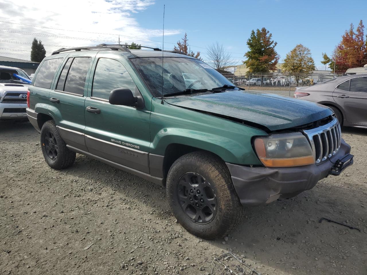 1999 Jeep Grand Cherokee VIN 1J4GW58S0XC700054 Copart auction photo, all over damage thumbnail 4