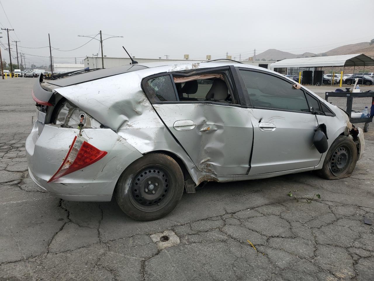 2010 Honda Insight VIN JHMZE2H56AS043184 Copart auction photo, all over damage thumbnail 3