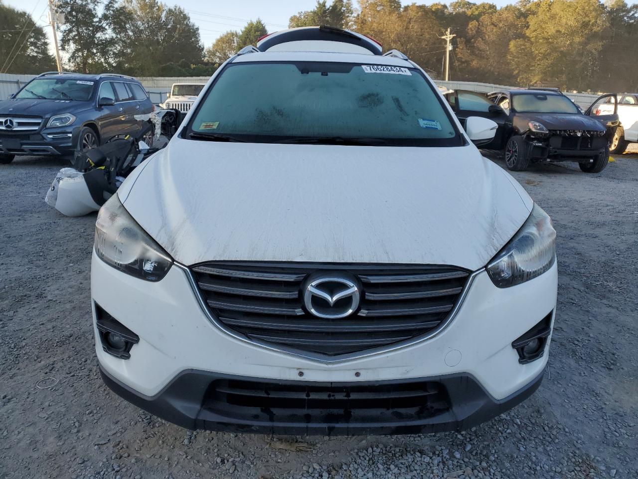 2016 Mazda CX-5 VIN JM3KE4DY1G0815276 Copart auction photo, rear end damage thumbnail 5