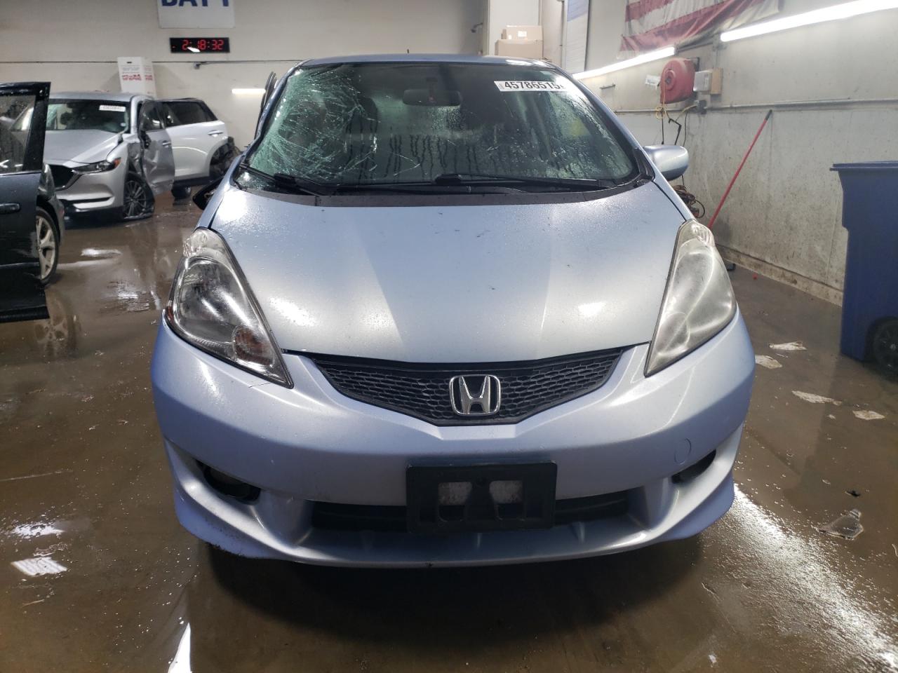 2010 Honda Fit VIN JHMGE8H4XAC000933 Copart auction photo, side / front end damage thumbnail 5