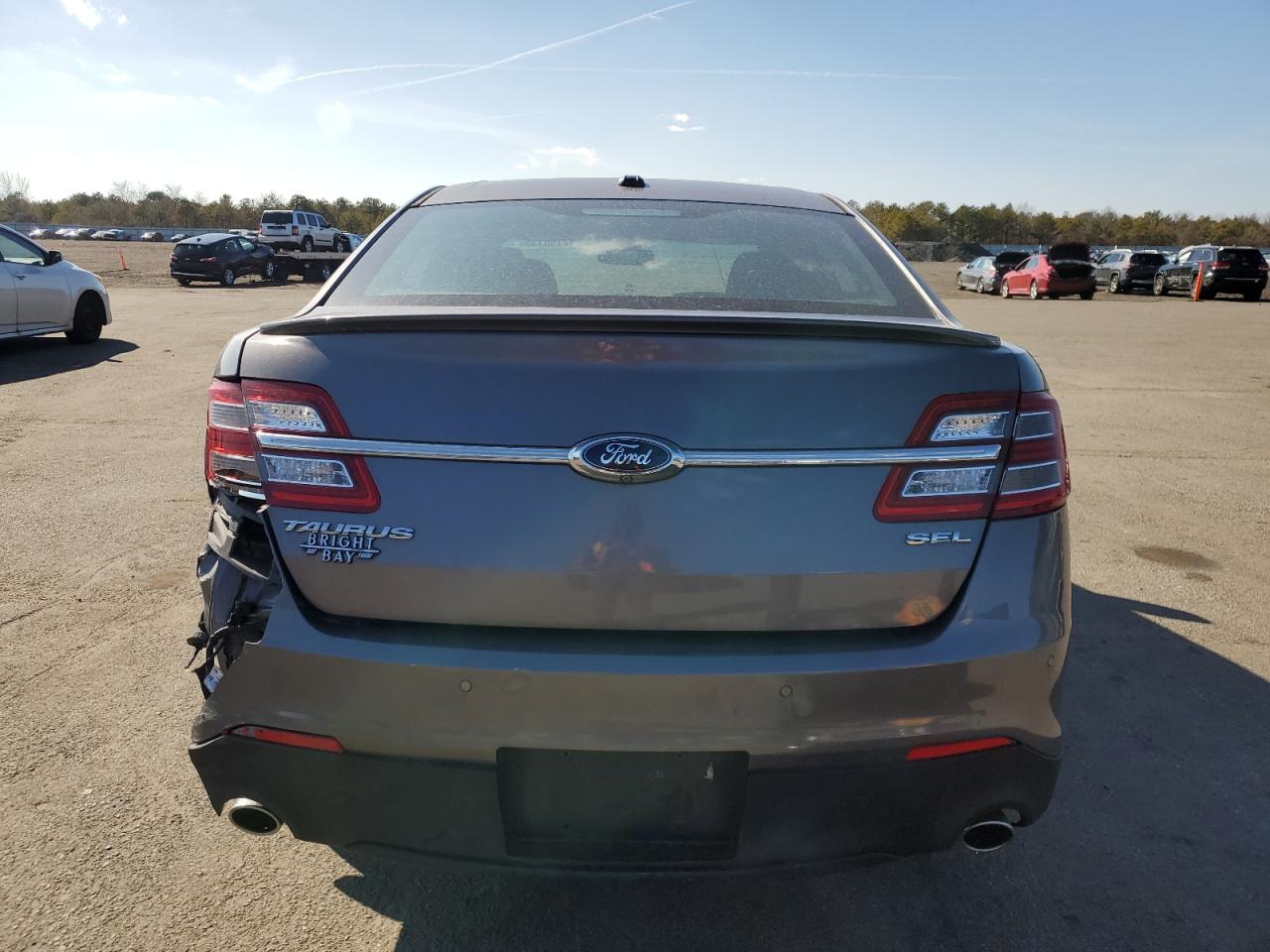 2014 Ford Taurus VIN 1FAHP2E87EG130421 Copart auction photo, rear end / minor dent/scratches damage thumbnail 6