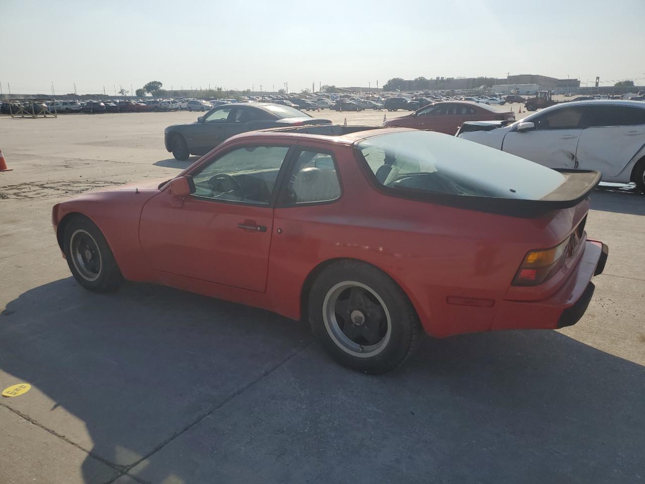 1985 Porsche 944 VIN WP0AA094XFN471379 Copart auction photo, top/roof damage thumbnail 2