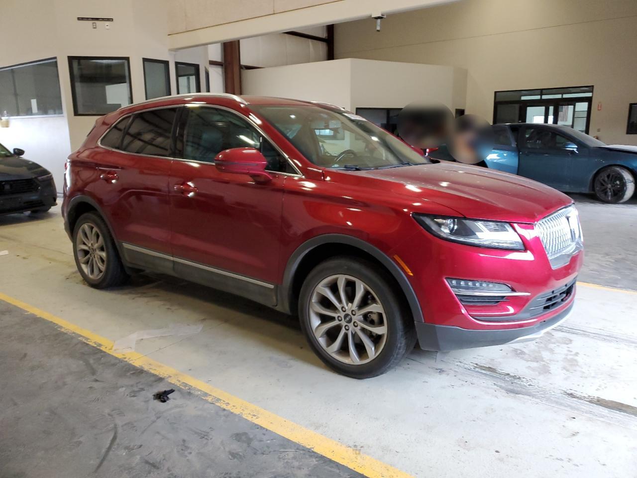 2019 Lincoln MKC VIN 5LMCJ2C96KUL03000 Copart auction photo, undercarriage / hail damage thumbnail 4
