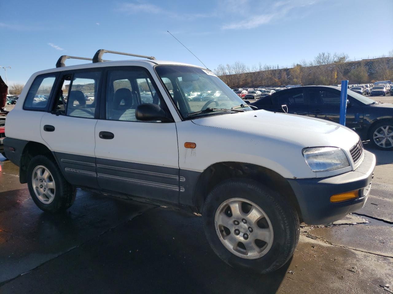 1997 Toyota RAV 4 VIN JT3HP10V2V7026764 Copart auction photo, rear end / hail damage thumbnail 4