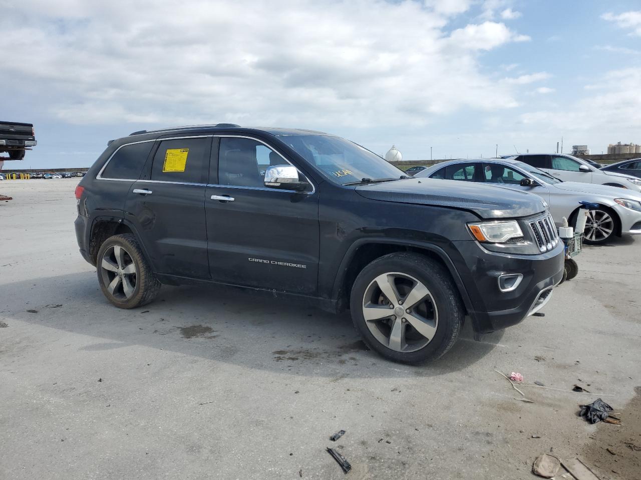 2014 Jeep Grand Cherokee VIN 1C4RJECGXEC357265 Copart auction photo, side / front end damage thumbnail 4