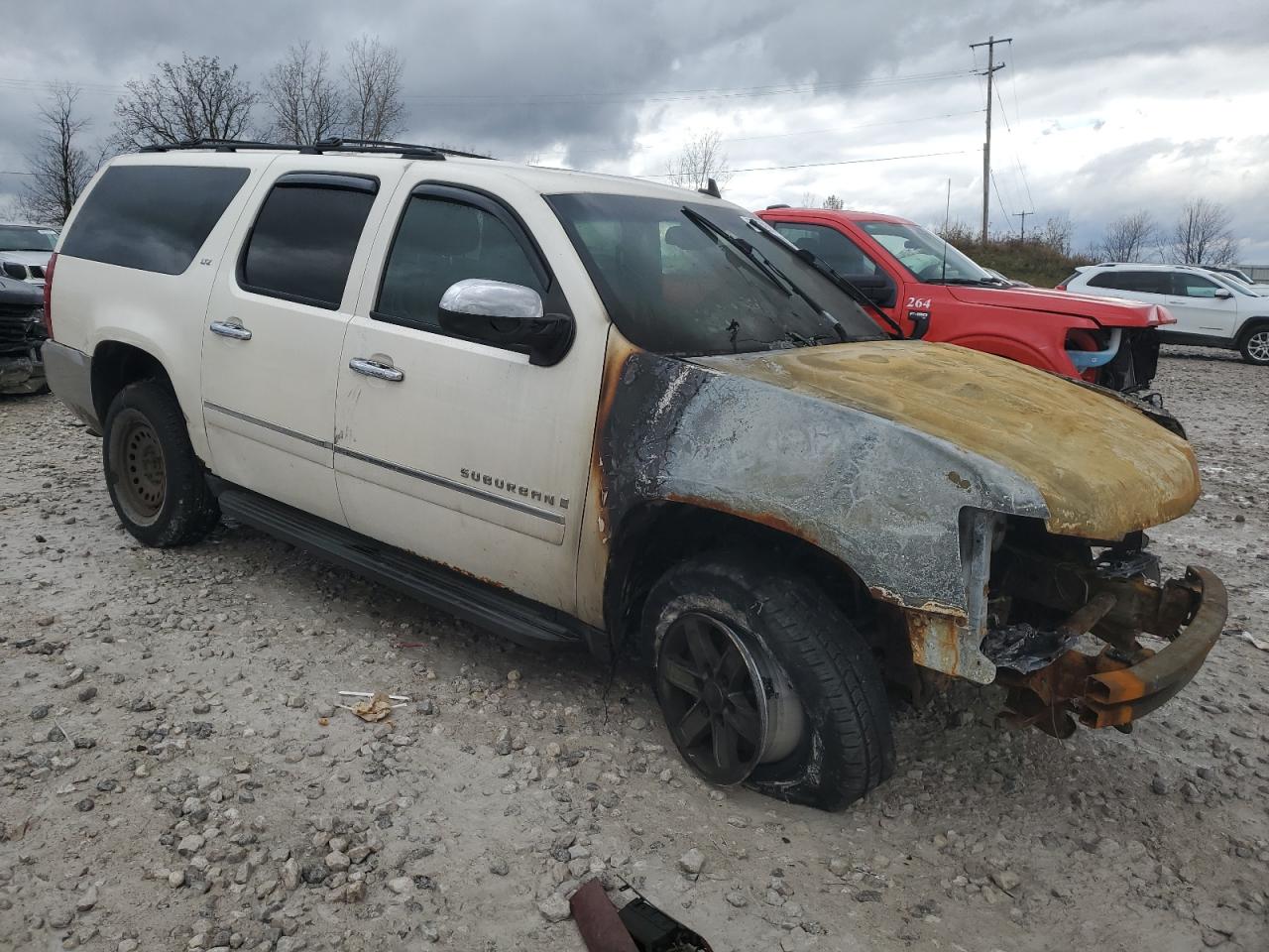 2009 Chevrolet Suburban VIN 1GNFK36359R214019 Copart auction photo, burn damage thumbnail 4