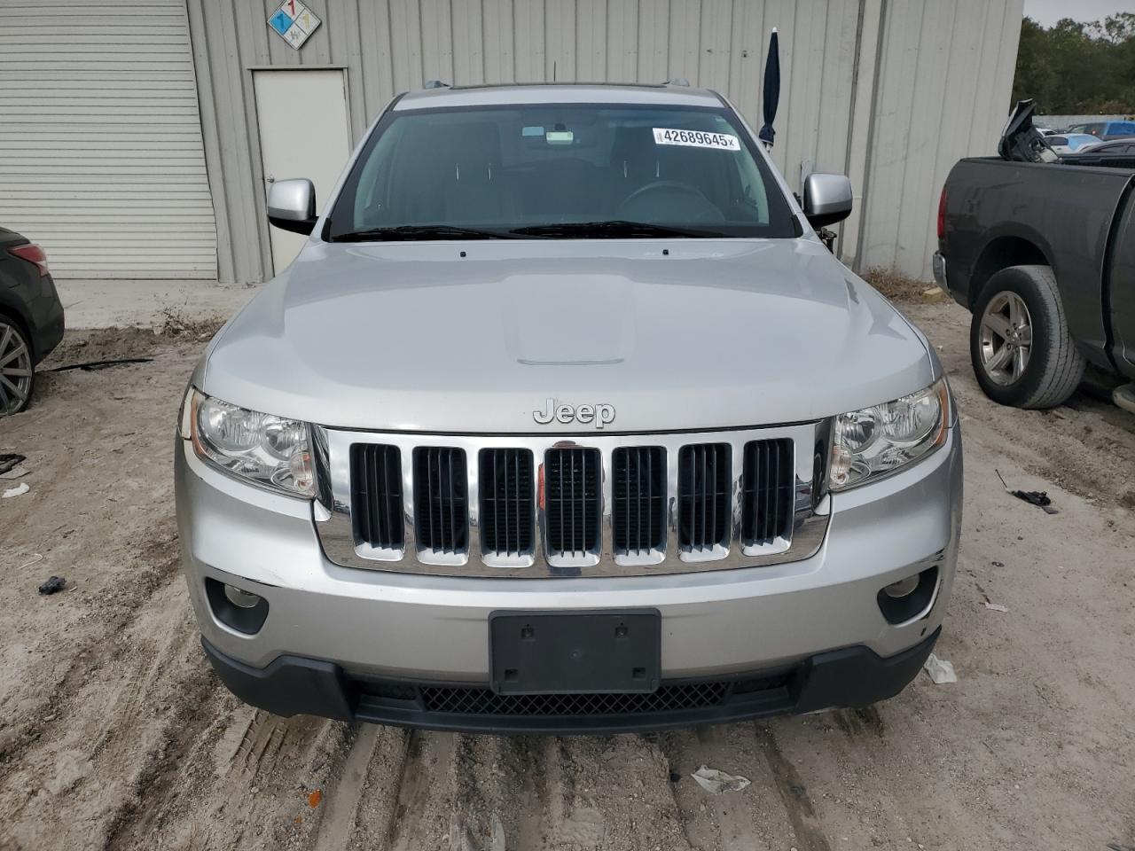 2012 Jeep Grand Cherokee VIN 1C4RJFAG0CC201063 Copart auction photo, front end damage thumbnail 5