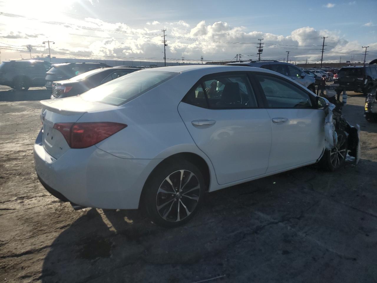 2017 Toyota Corolla VIN 5YFBURHE4HP604699 Copart auction photo, front end / side damage thumbnail 3