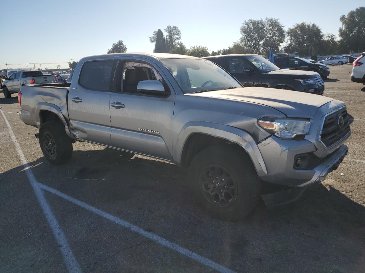 2019 Toyota Tacoma VIN 3TMAZ5CN9KM102752 Copart auction photo, side / front end damage thumbnail 4