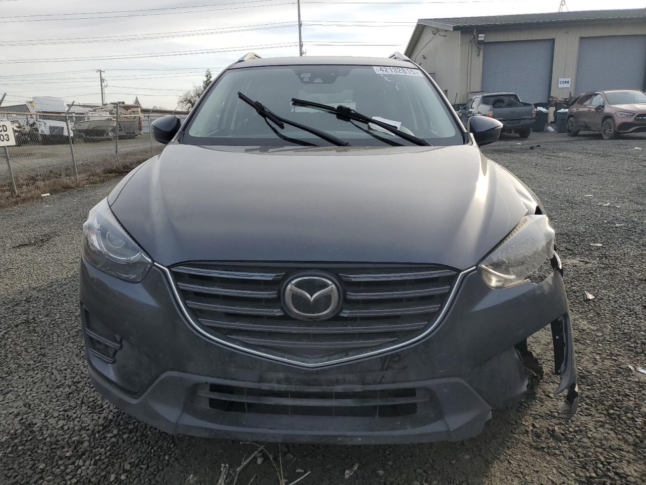 2016 Mazda CX-5 VIN JM3KE4DY0G0876540 Copart auction photo, all over damage thumbnail 5