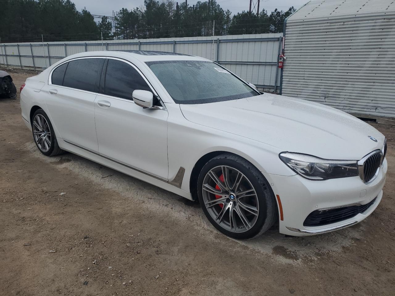 2016 BMW 7er VIN WBA7E2C52GG738755 Copart auction photo, front end / side damage thumbnail 4