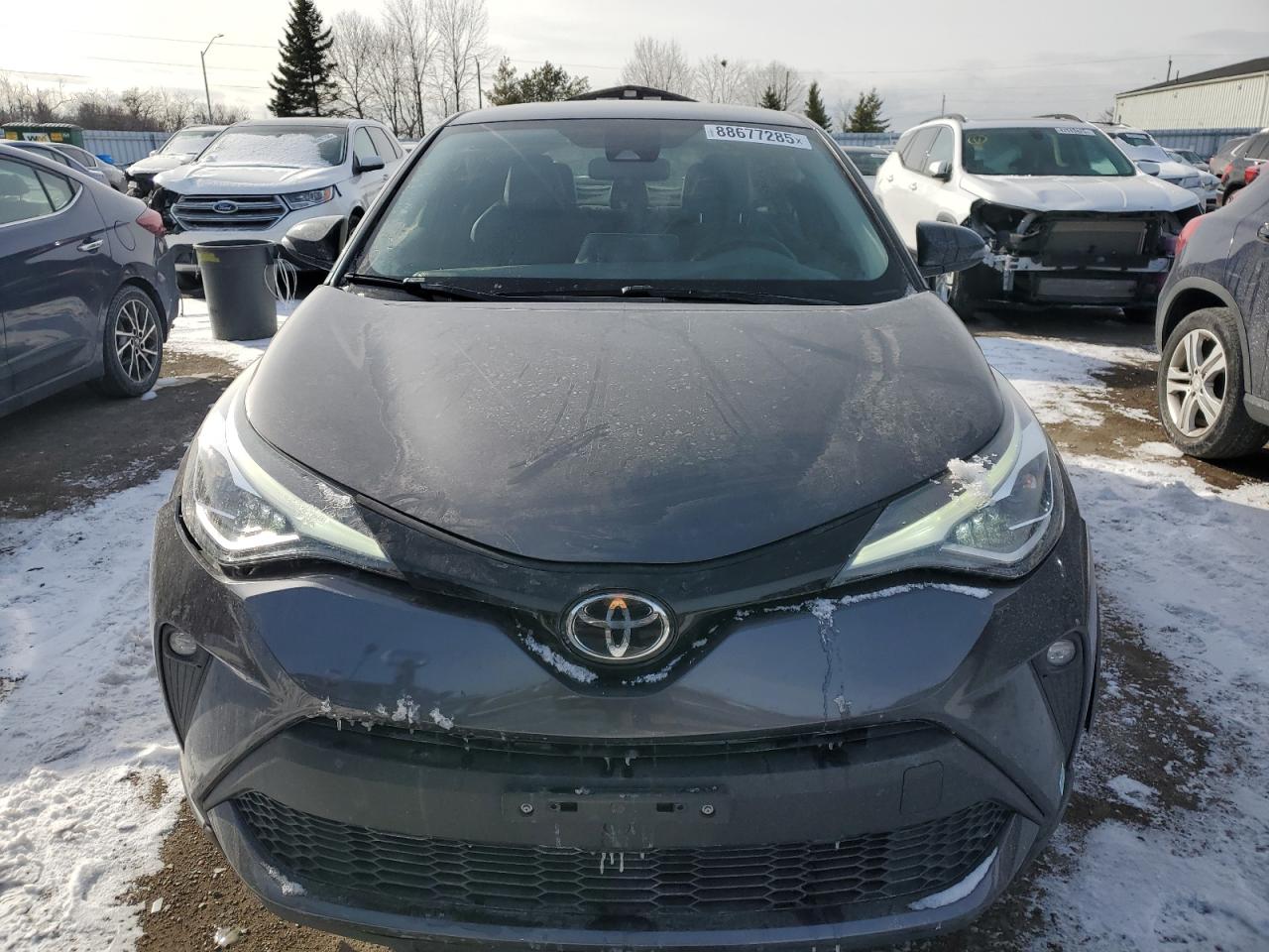 2021 Toyota C-HR VIN JTNKHMBX3M1113035 Copart auction photo, front end / undercarriage damage thumbnail 5