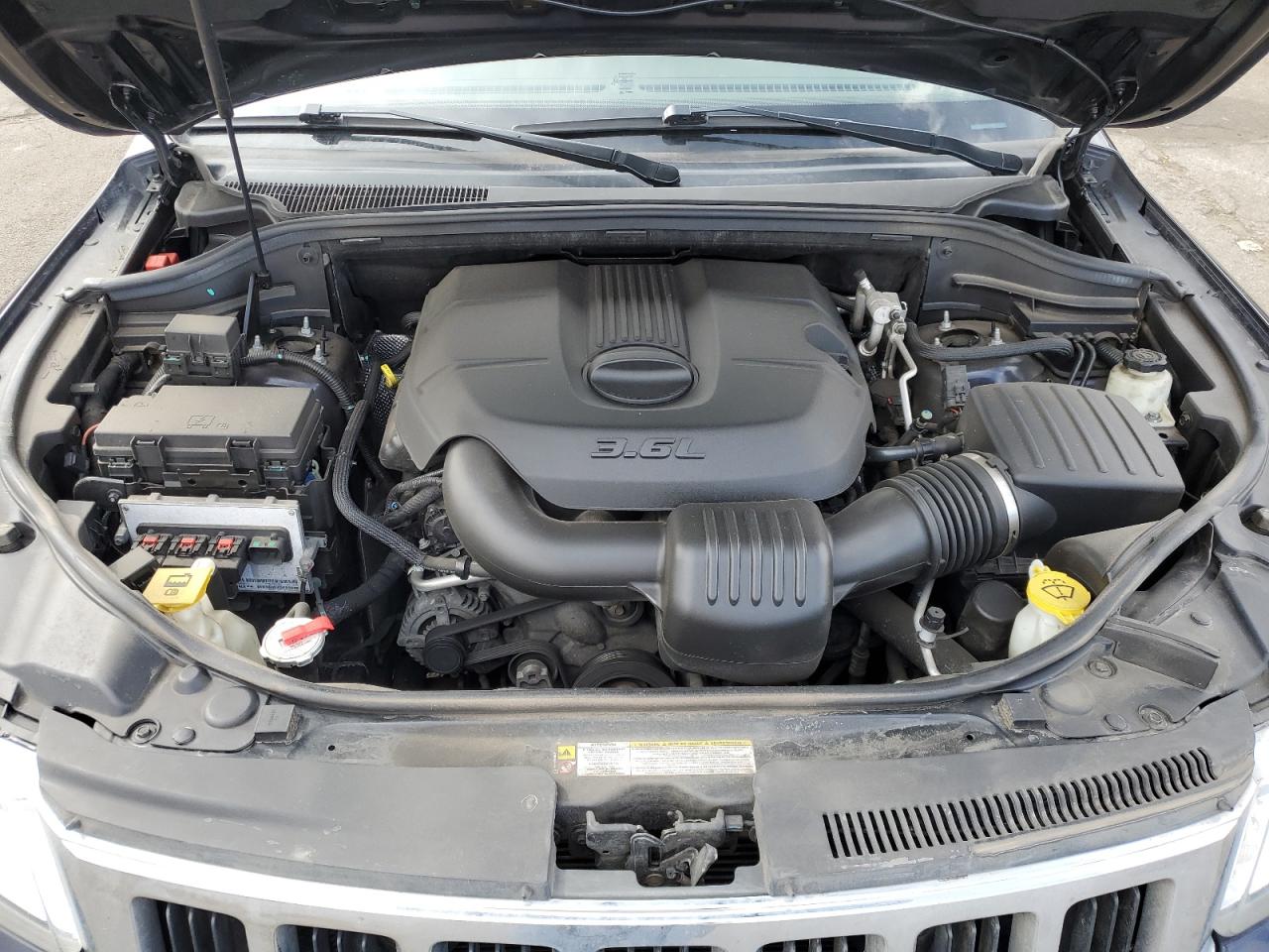 2011 Jeep Grand Cherokee VIN 1J4RR4GG8BC660743 Copart auction photo, side damage thumbnail 14