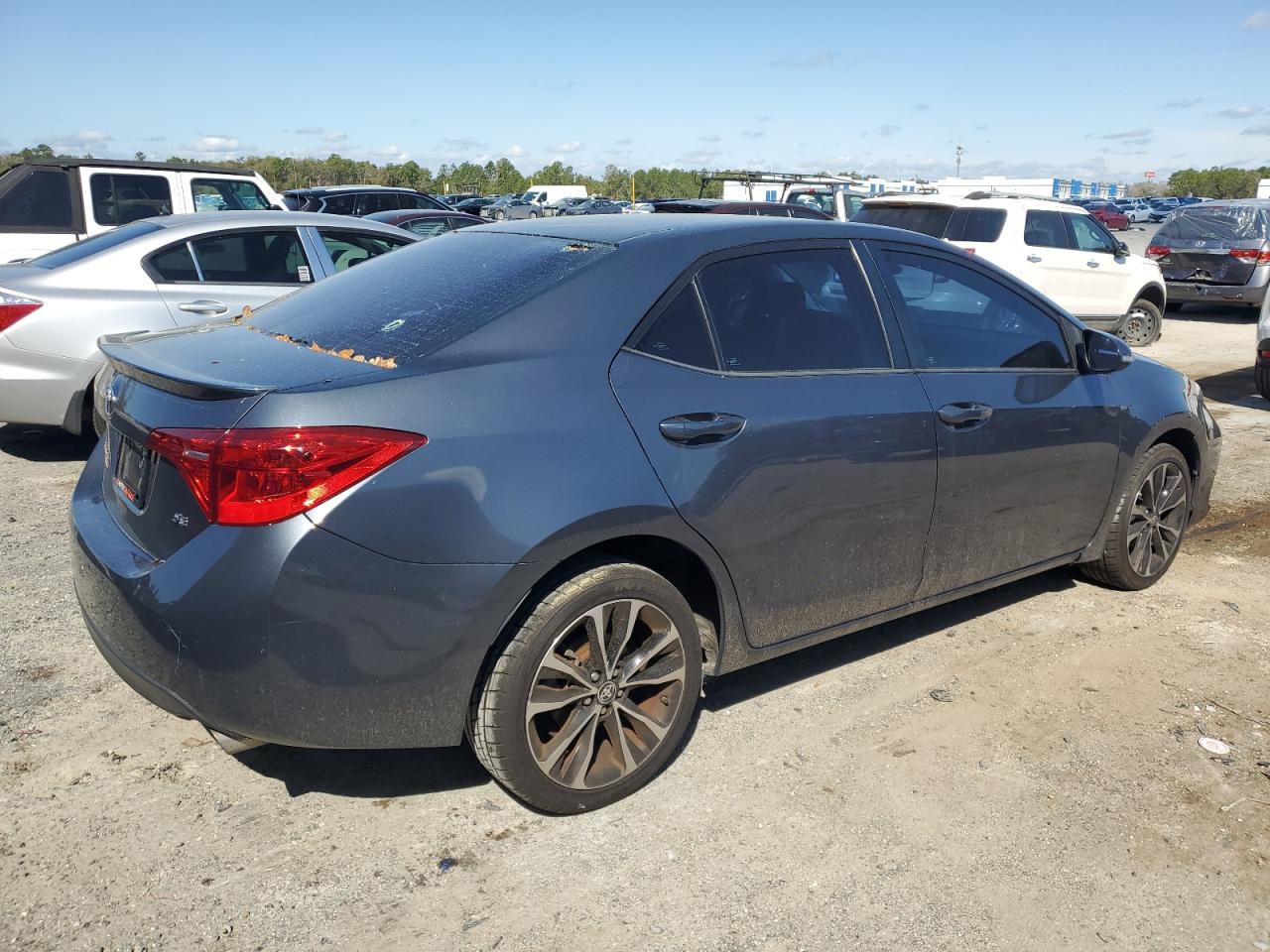 2018 Toyota Corolla VIN 5YFBURHE5JP849145 Copart auction photo, vandalism damage thumbnail 3