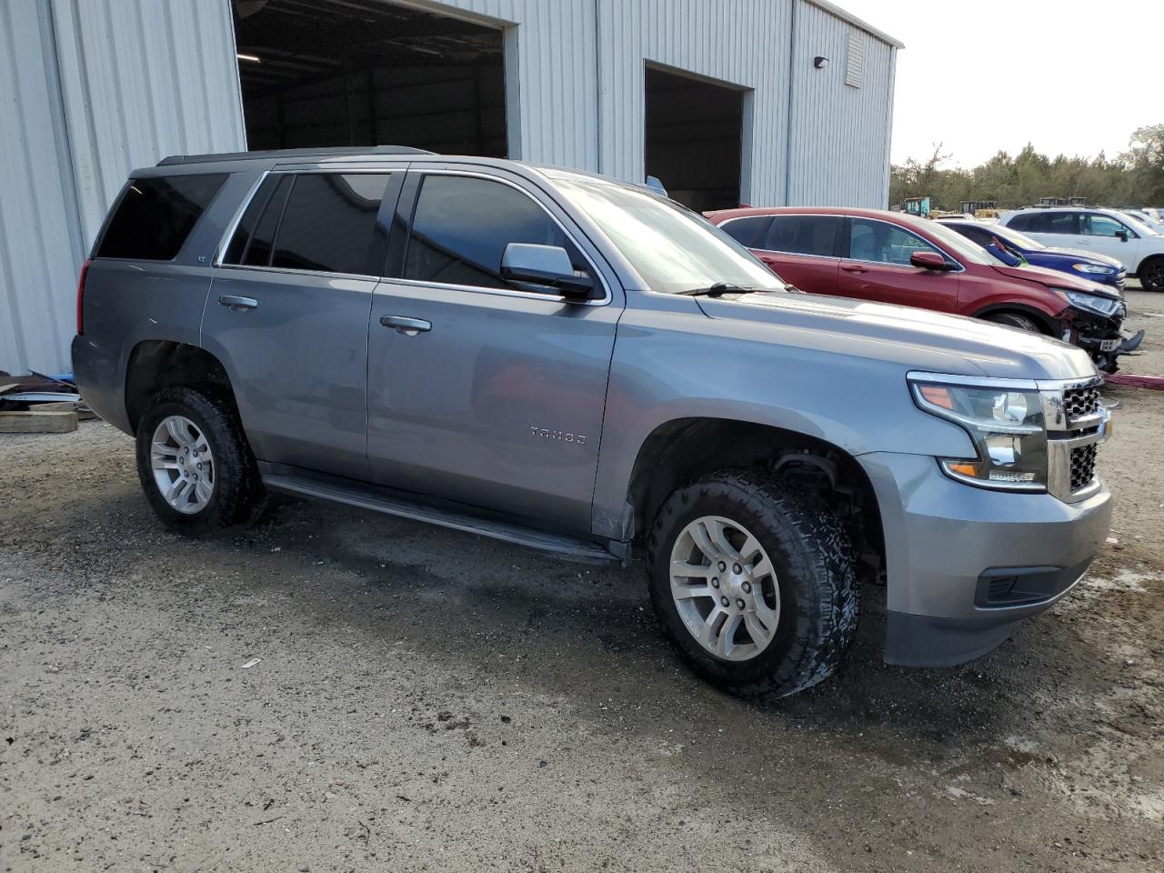 2019 Chevrolet Tahoe VIN 1GNSKBKC3KR162443 Copart auction photo, side / front end damage thumbnail 4