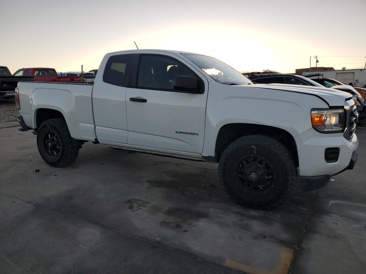 2018 GMC Canyon VIN 1GTH5BEA4J1107033 Copart auction photo, side / front end damage thumbnail 4