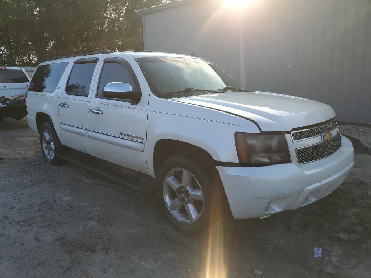 2008 Chevrolet Suburban VIN 1GNFC16048R228113 Copart auction photo, side / undercarriage damage thumbnail 4