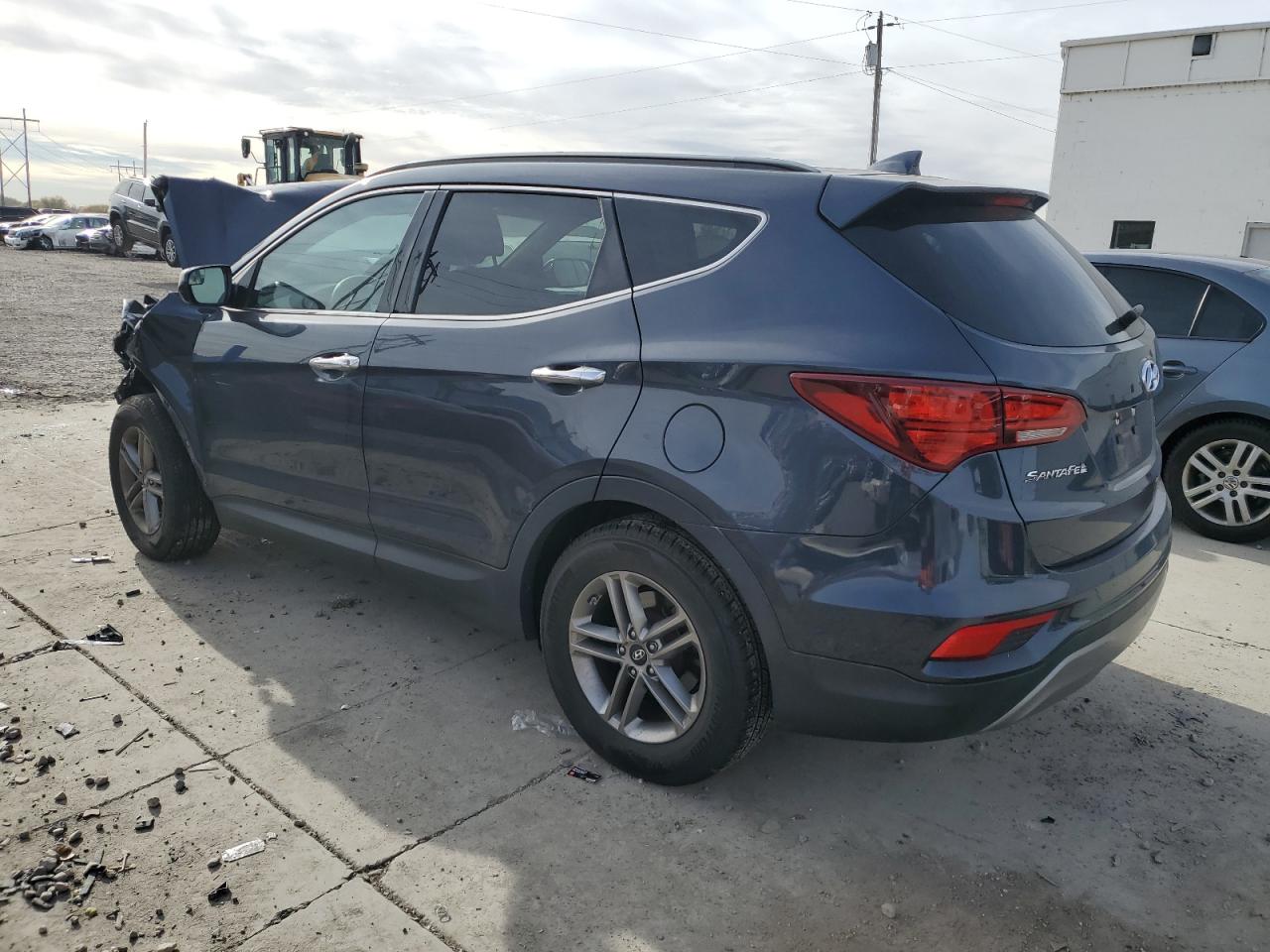 2017 Hyundai Santa Fe VIN 5NMZU3LB2HH038447 Copart auction photo, front end / side damage thumbnail 2