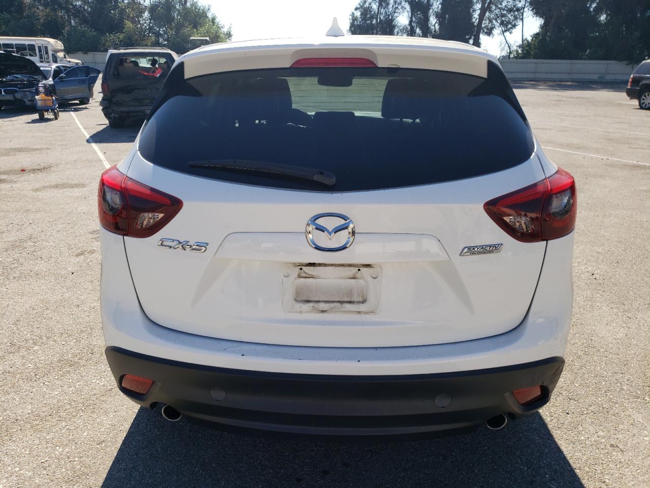 2016 Mazda CX-5 VIN JM3KE2DYXG0729064 Copart auction photo, side damage thumbnail 6