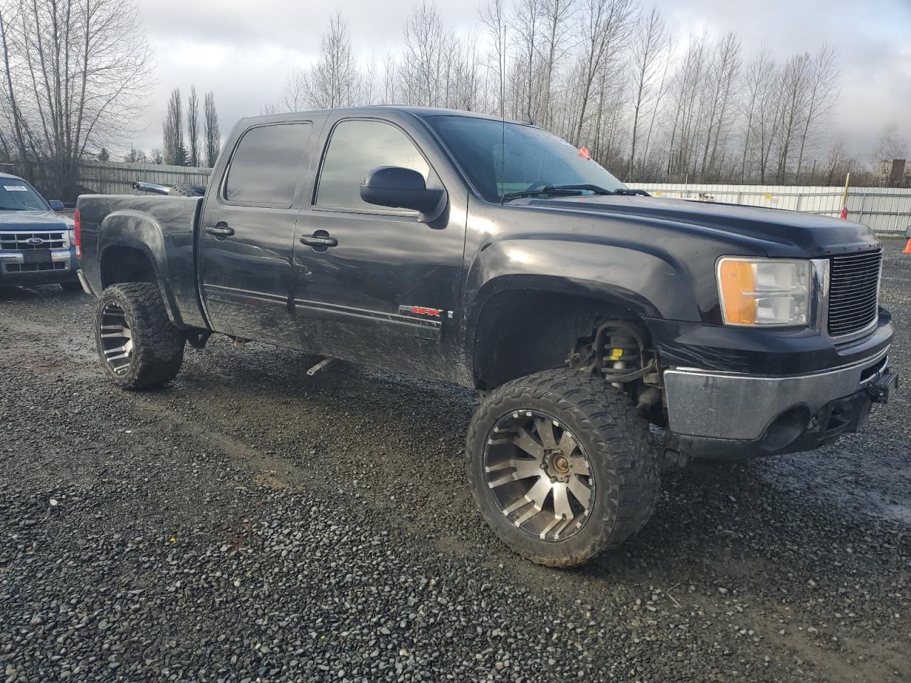 2007 GMC Sierra VIN 2GTFK13Y271559799 Copart auction photo, front end / side damage thumbnail 4