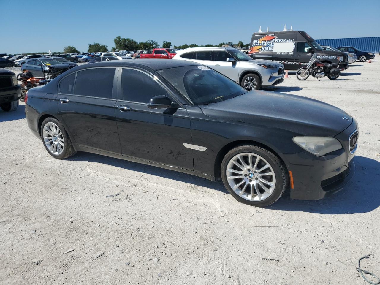 2015 BMW 7er VIN WBAYF4C57FG291819 Copart auction photo, minor dent/scratches damage thumbnail 4