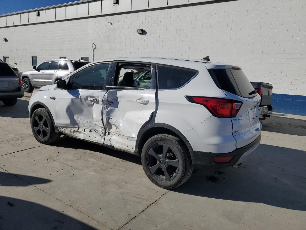 2019 Ford Escape VIN 1FMCU9GD0KUB39180 Copart auction photo, side damage thumbnail 2