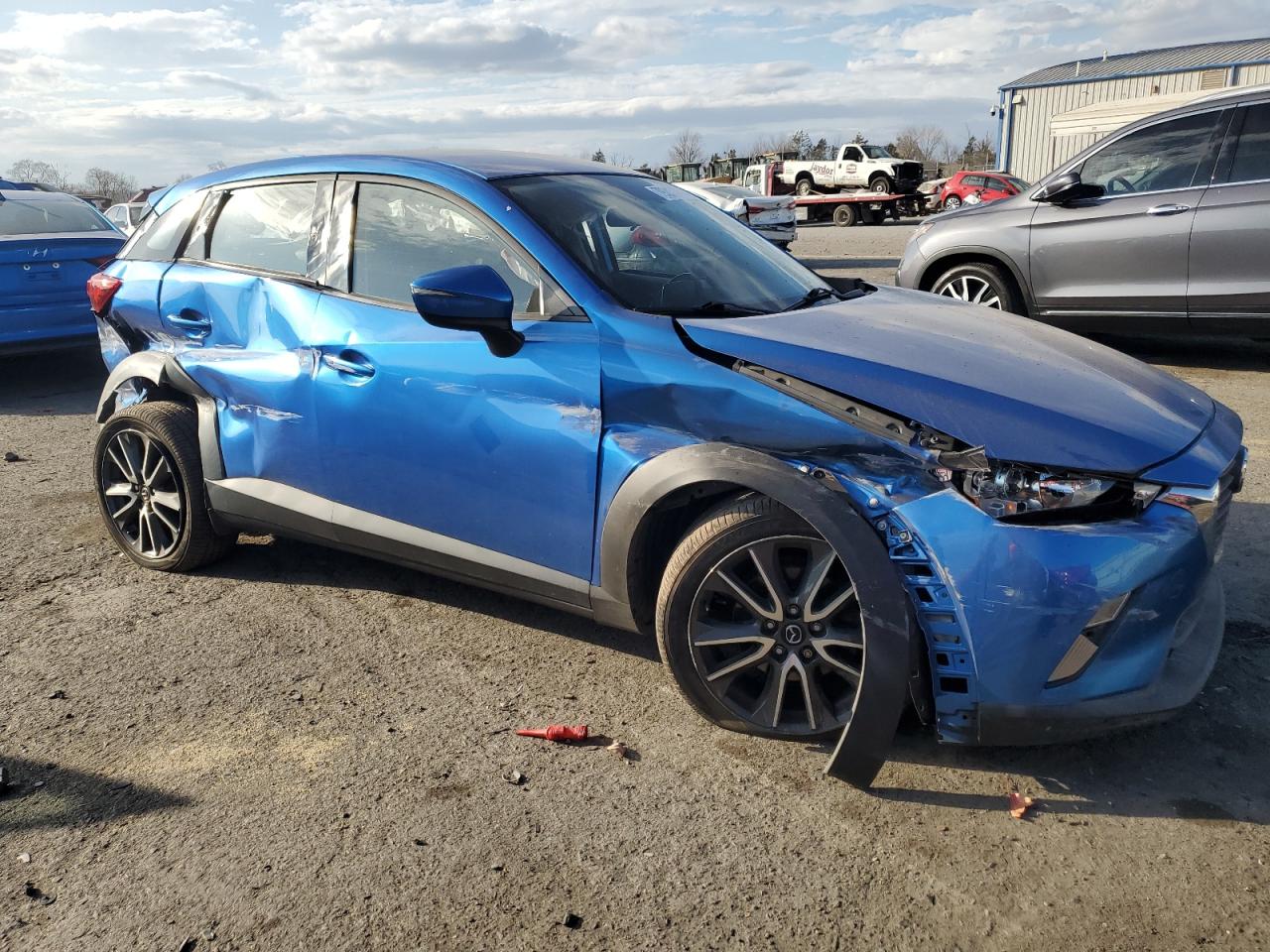 2017 Mazda CX-3 VIN JM1DKFC79H0167847 Copart auction photo, side / front end damage thumbnail 4