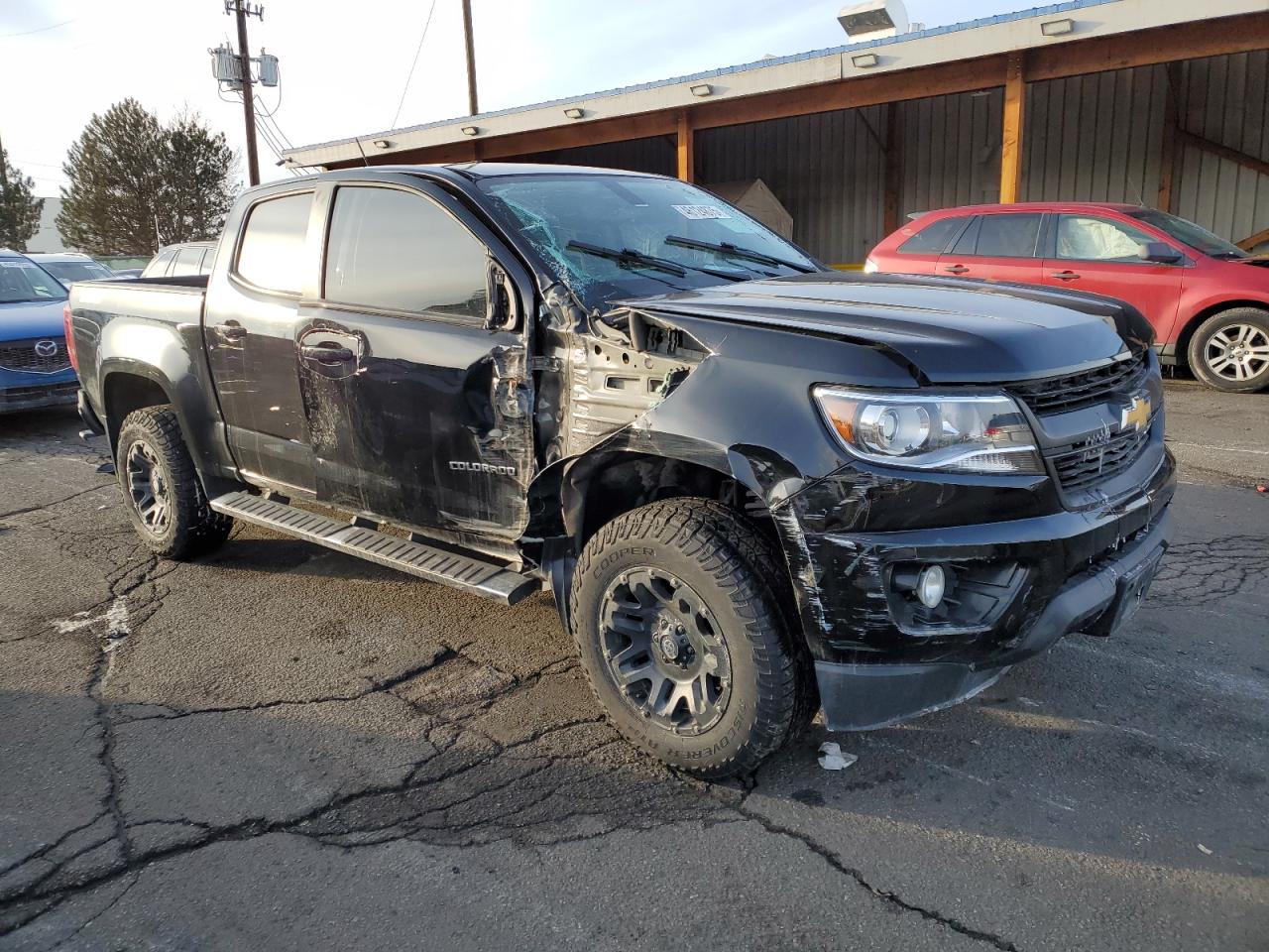 2016 Chevrolet Colorado VIN 1GCGTDE39G1385255 Copart auction photo, side / front end damage thumbnail 4