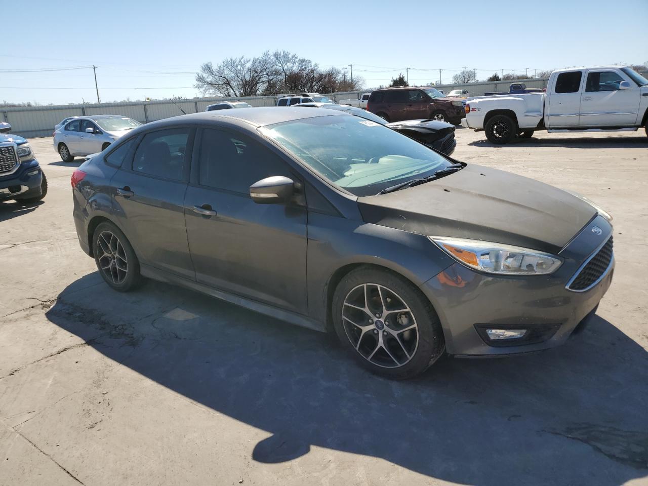 2015 Ford Focus VIN 1FADP3F2XFL313335 Copart auction photo, all over damage thumbnail 4
