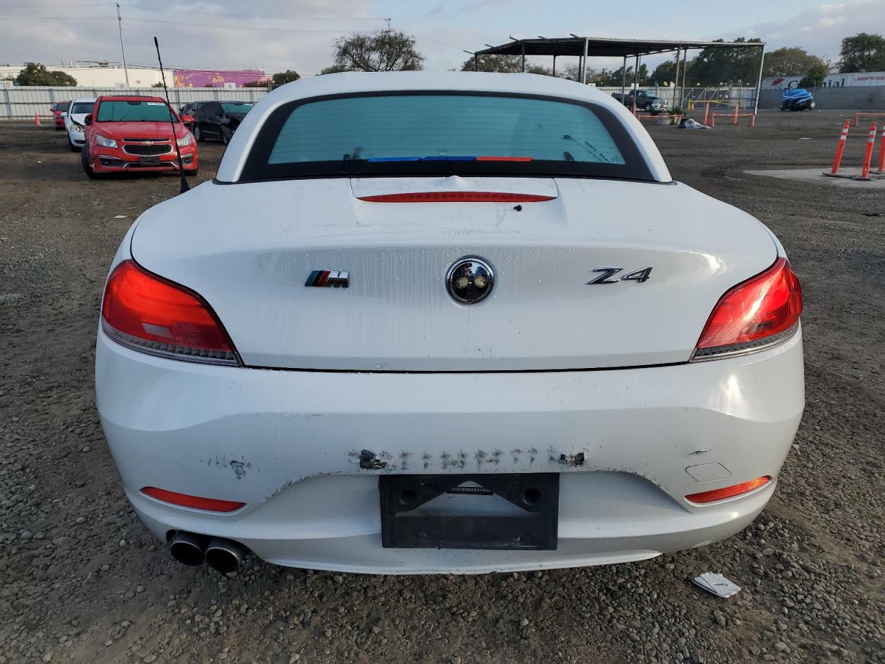 2010 BMW Z4 VIN WBALM5C56AE377066 Copart auction photo, front end / side damage thumbnail 6