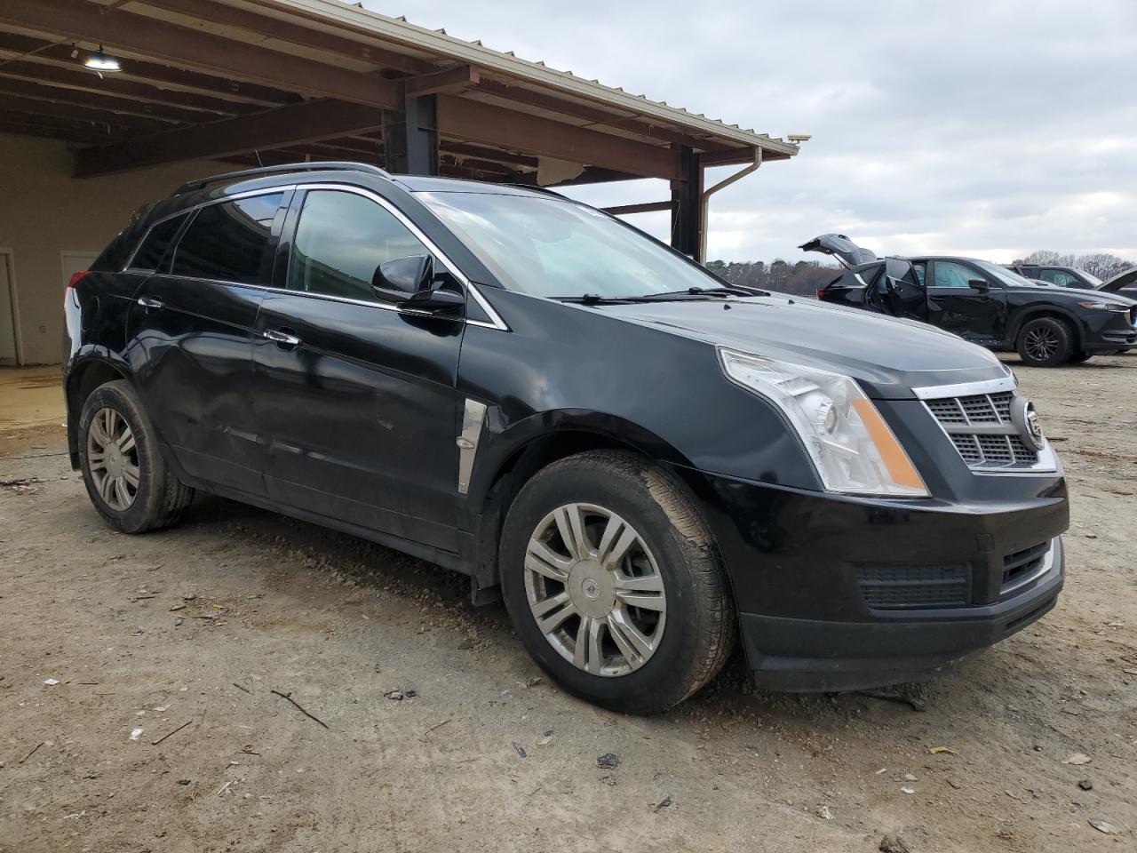 2011 Cadillac SRX VIN 3GYFNGEY0BS653923 Copart auction photo, front end / side damage thumbnail 4