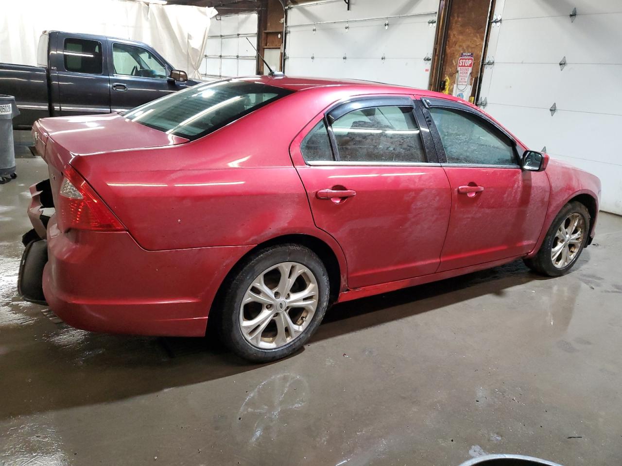 2012 Ford Fusion VIN 3FAHP0HAXCR216931 Copart auction photo, side / rear end damage thumbnail 3