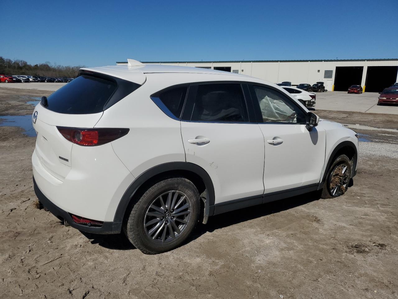 2021 Mazda CX-5 VIN JM3KFACM3M0442960 Copart auction photo, side damage thumbnail 3