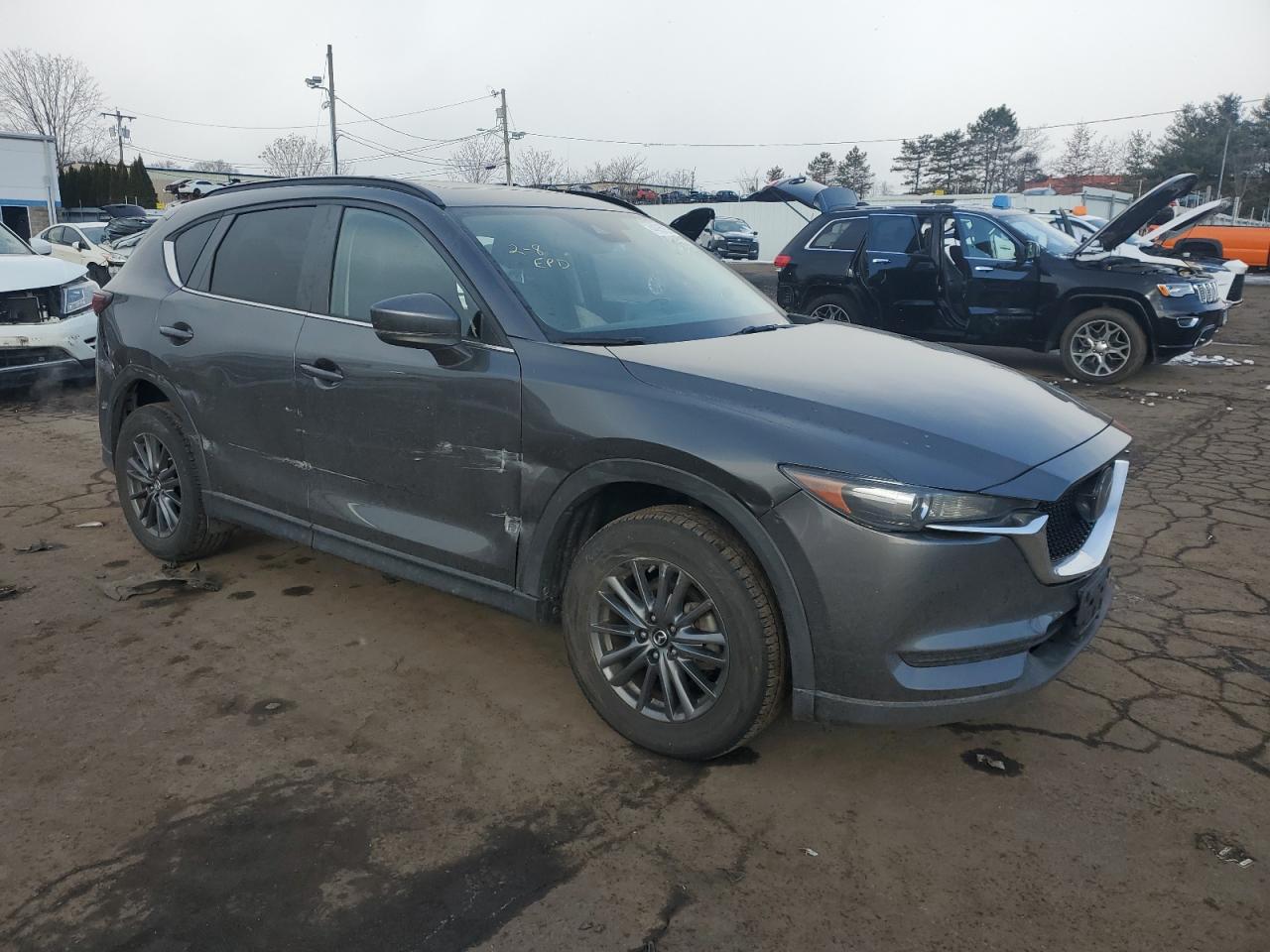 2019 Mazda CX-5 VIN JM3KFBCM4K0502652 Copart auction photo, side / rear end damage thumbnail 4