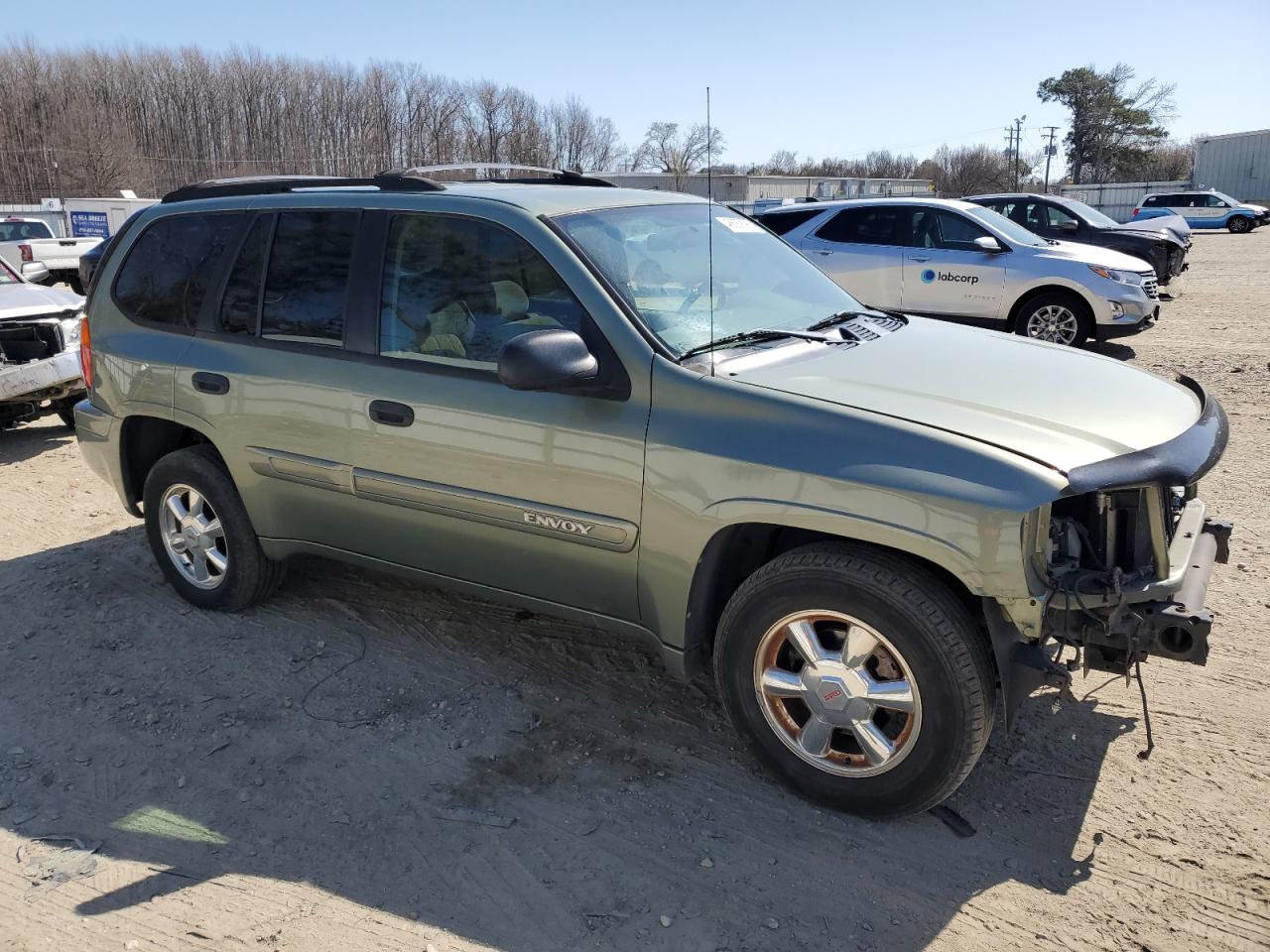 2004 GMC Envoy VIN 1GKDS13S542324252 Copart auction photo, front end / minor dent/scratches damage thumbnail 4