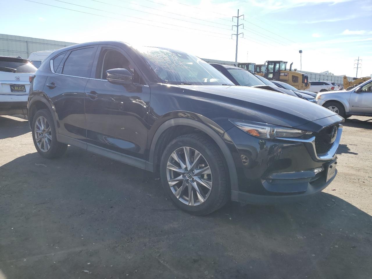 2021 Mazda CX-5 VIN JM3KFADM2M1320602 Copart auction photo, hail damage thumbnail 4