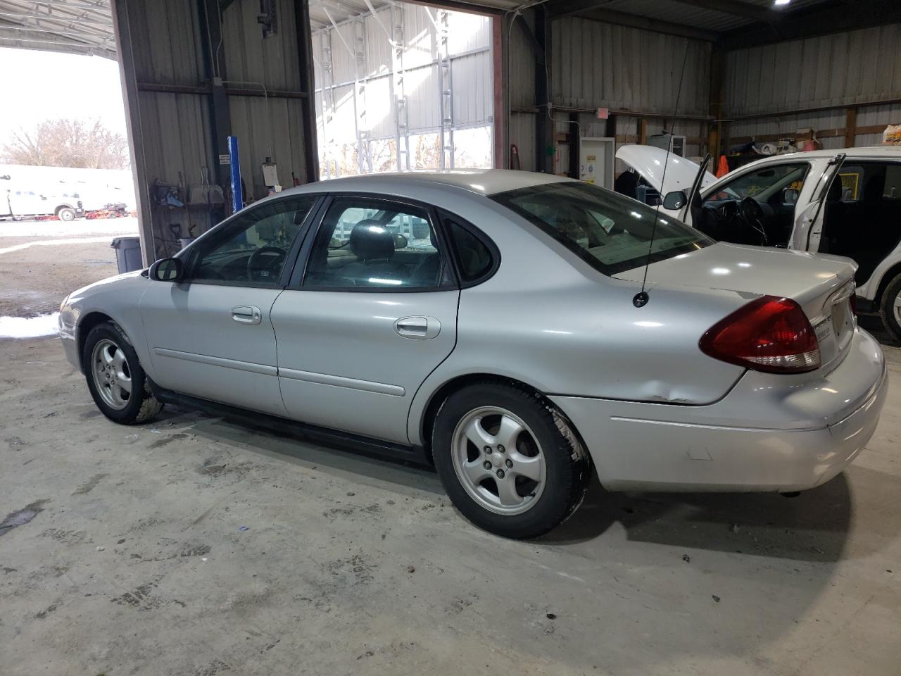 2005 Ford Taurus VIN 1FAFP53U05A312036 Copart auction photo, side / minor dent/scratches damage thumbnail 2