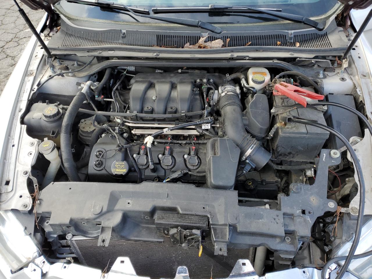 2014 Ford Taurus VIN 1FAHP2F8XEG110985 Copart auction photo, minor dent/scratches / front end damage thumbnail 11