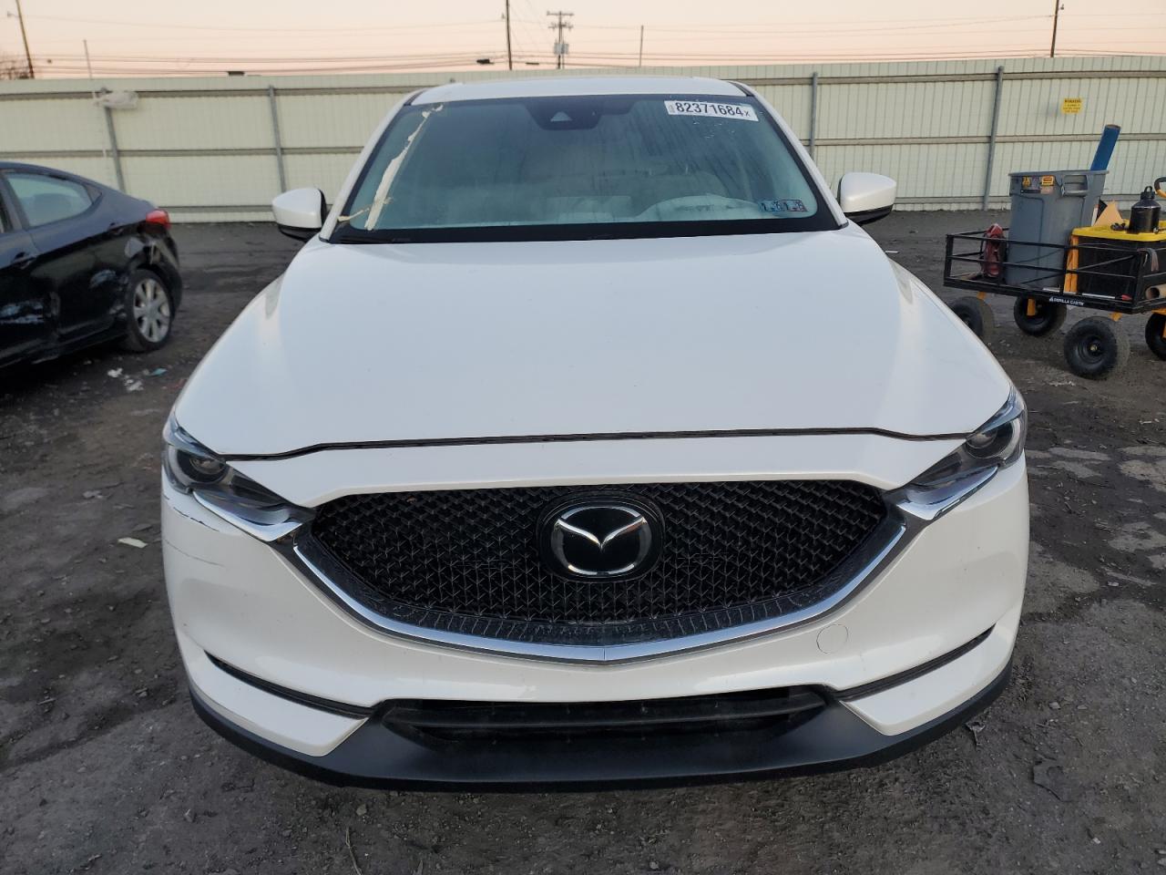 2021 Mazda CX-5 VIN JM3KFBDM7M0489767 Copart auction photo, burn - interior / side damage thumbnail 5