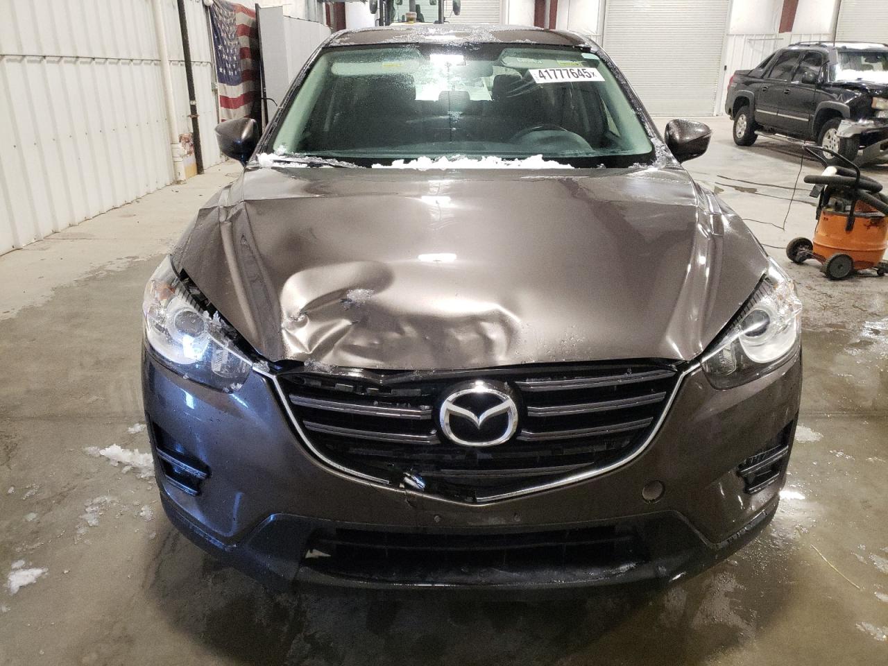 2016 Mazda CX-5 VIN JM3KE4BY9G0879973 Copart auction photo, front end / side damage thumbnail 5