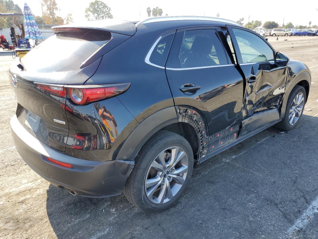 2023 Mazda CX-30 VIN 3MVDMBDM8PM527692 Copart auction photo, side / front end damage thumbnail 3